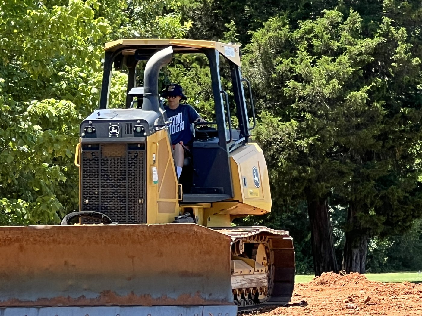 Colette Murray operating a tracked dozer, moving soil